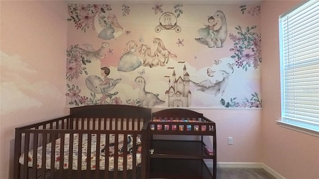 bedroom with multiple windows and a crib