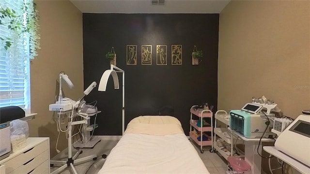 bedroom featuring light tile patterned floors