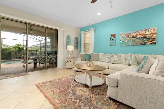 living room with light tile patterned floors and ceiling fan