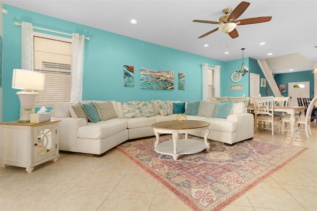 living room with light tile patterned flooring and ceiling fan