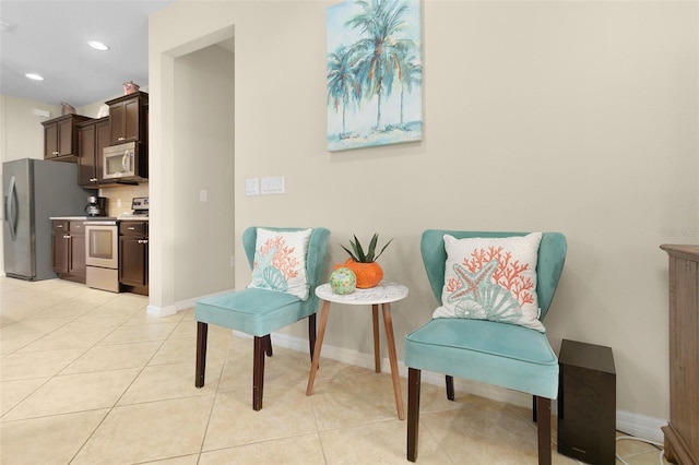 living area featuring light tile patterned floors