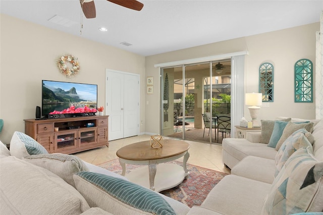 tiled living room with ceiling fan