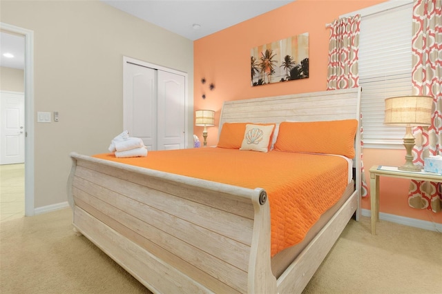 bedroom featuring carpet and a closet