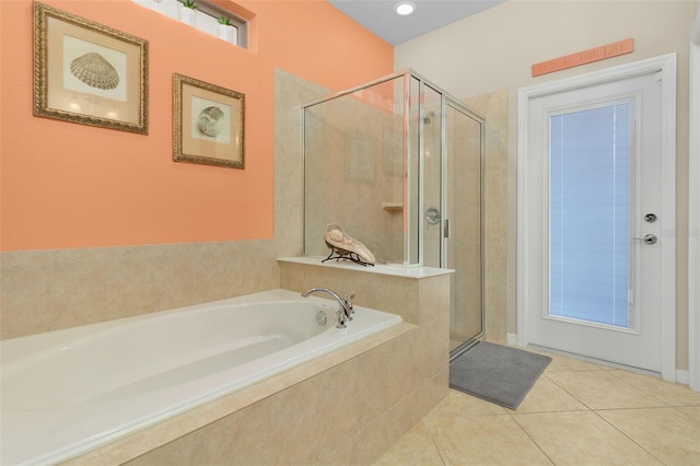 bathroom with tile patterned floors and plus walk in shower