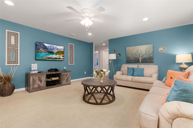 living room featuring light colored carpet and ceiling fan