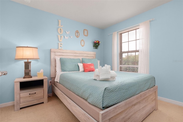 bedroom featuring light colored carpet