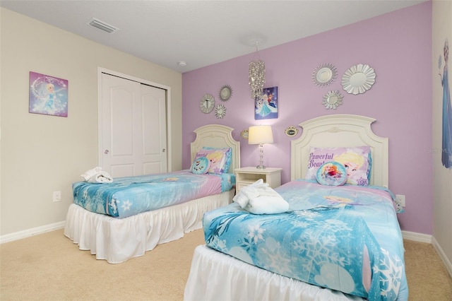 bedroom with carpet floors and a closet