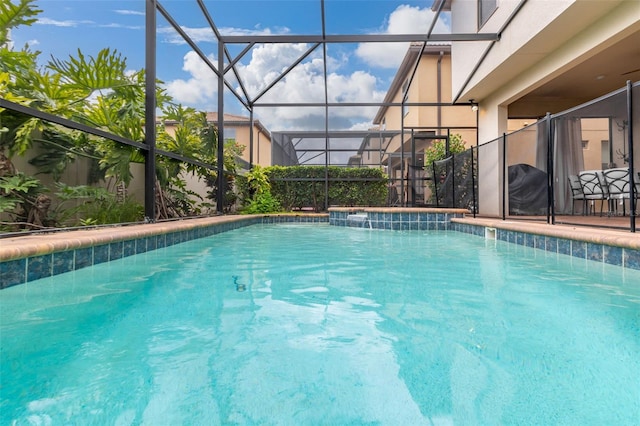 view of pool featuring a lanai and pool water feature