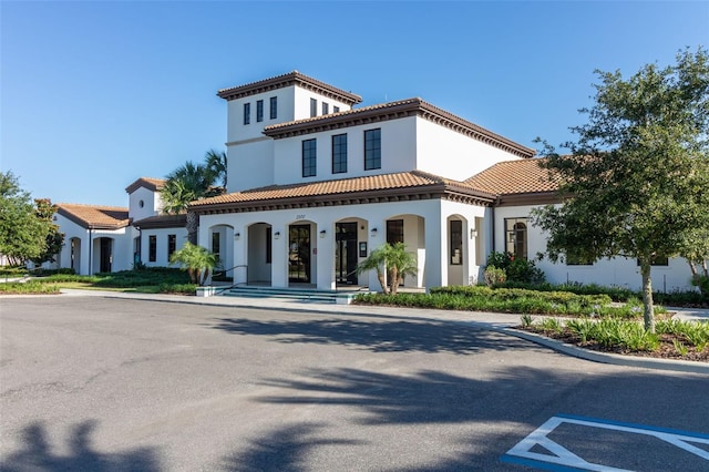 mediterranean / spanish-style house with a porch