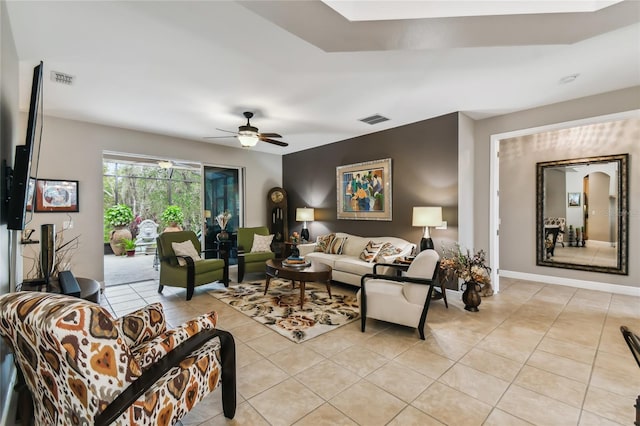 tiled living room featuring ceiling fan