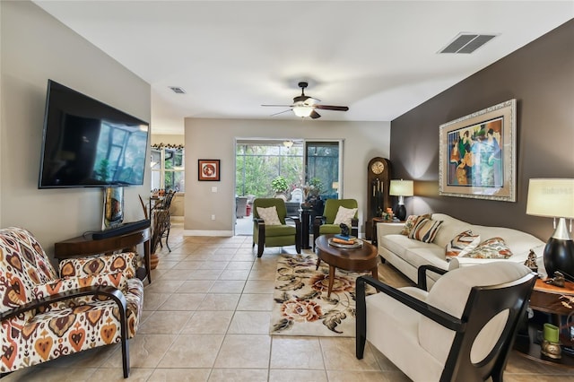 living room featuring ceiling fan and light tile patterned flooring