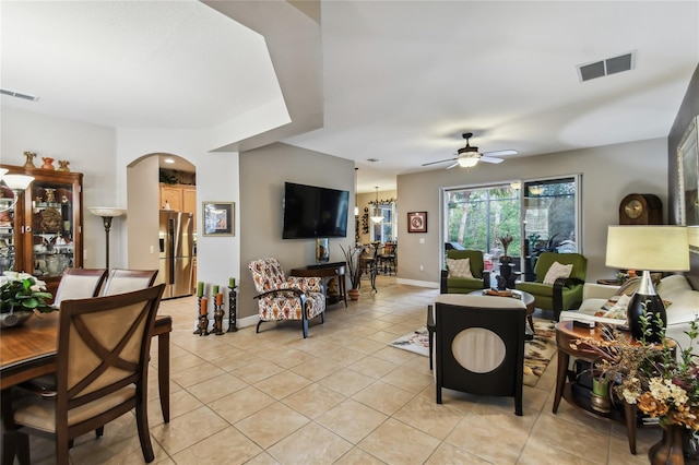 living room with ceiling fan and light tile patterned flooring