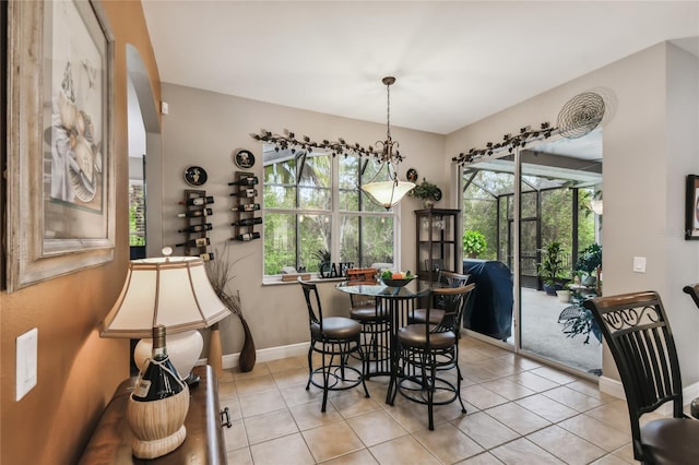 tiled dining room featuring a wealth of natural light