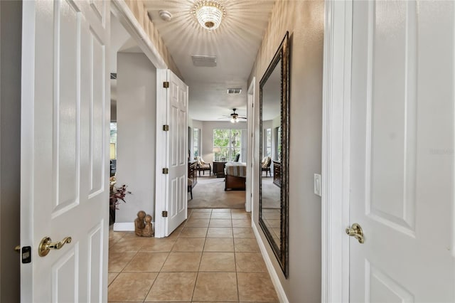 corridor featuring light tile patterned flooring