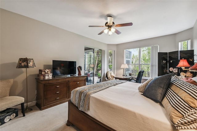 carpeted bedroom with access to exterior and ceiling fan