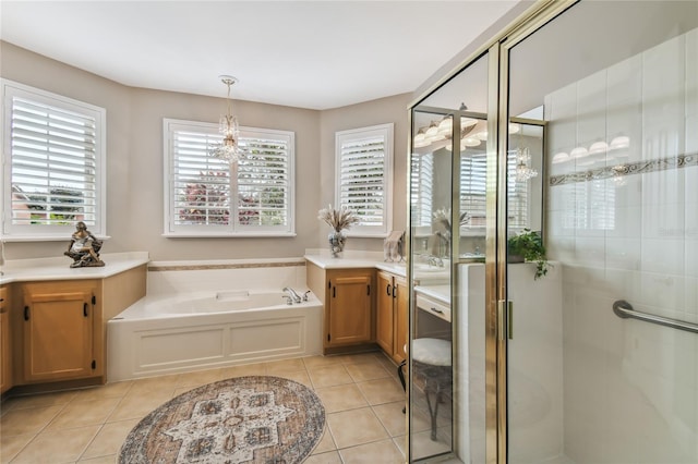 bathroom with vanity, a chandelier, tile patterned floors, and shower with separate bathtub