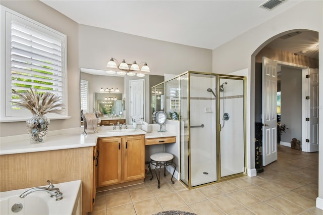 bathroom with vanity, tile patterned floors, and separate shower and tub