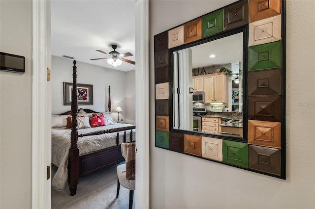 bedroom with ceiling fan and carpet flooring