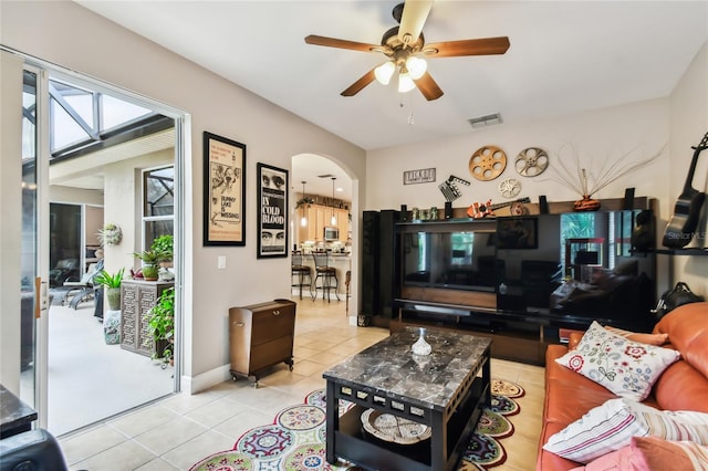 living room with light tile patterned floors and ceiling fan