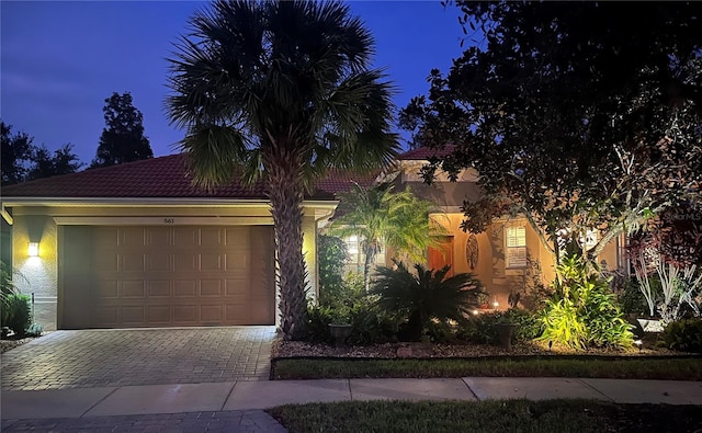 mediterranean / spanish-style house featuring a garage