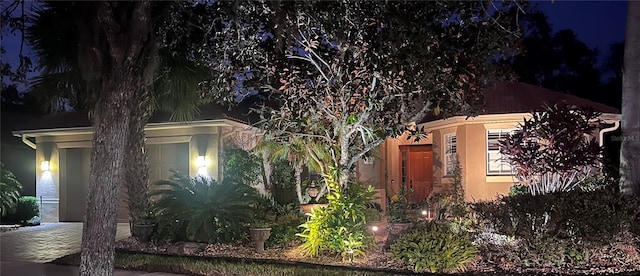 view of property exterior at twilight