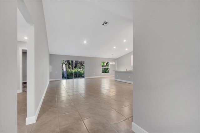 unfurnished living room featuring light tile patterned floors