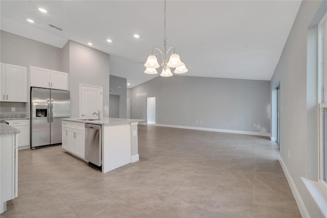 kitchen featuring white cabinets, stainless steel appliances, high vaulted ceiling, and a notable chandelier