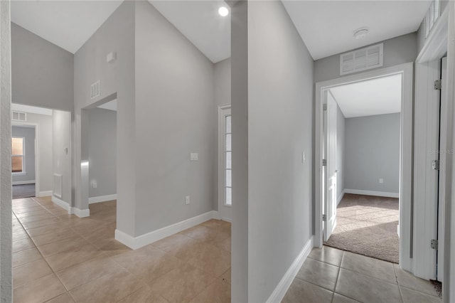 hallway featuring light tile patterned flooring