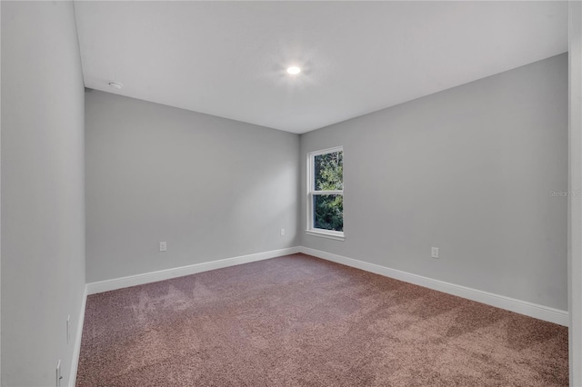 empty room featuring carpet flooring