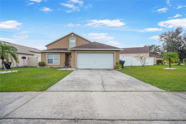 view of front facade with a garage and a front yard