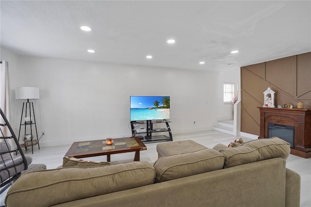 living room with light colored carpet and a textured ceiling