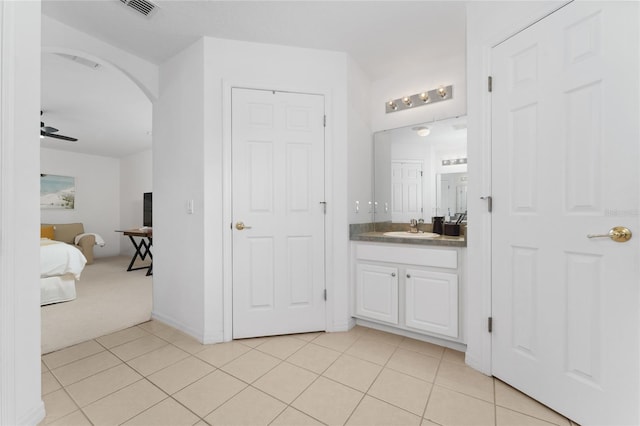 bathroom featuring vanity, tile patterned flooring, and ceiling fan