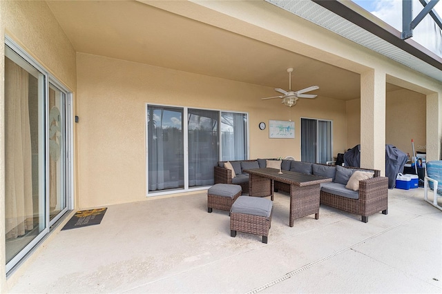 view of patio with ceiling fan and an outdoor living space