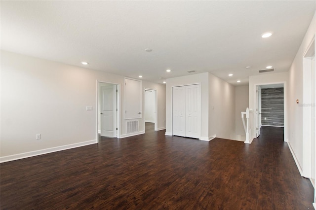 empty room with dark hardwood / wood-style floors