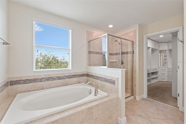 bathroom featuring independent shower and bath and tile patterned flooring