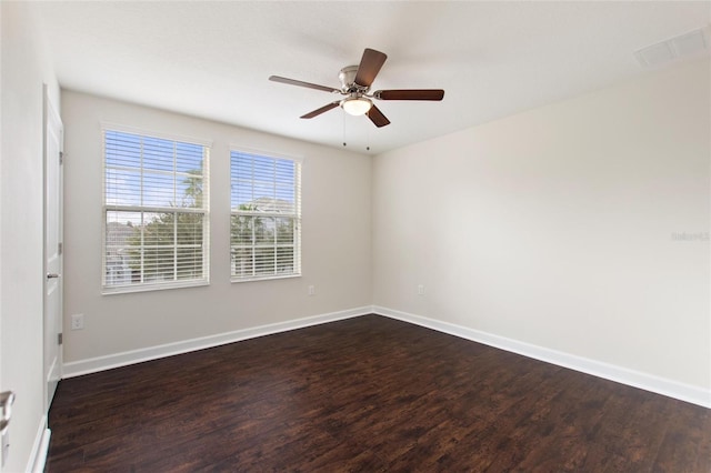 unfurnished room featuring ceiling fan and dark hardwood / wood-style floors