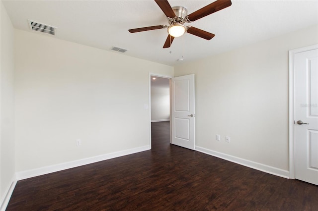 empty room featuring ceiling fan and dark hardwood / wood-style floors