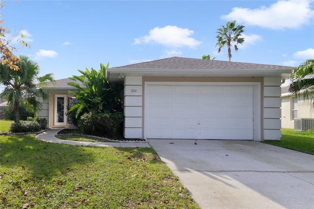 single story home featuring a front lawn, a garage, and central AC