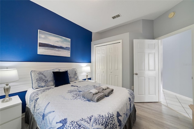 bedroom with a closet and light wood-type flooring