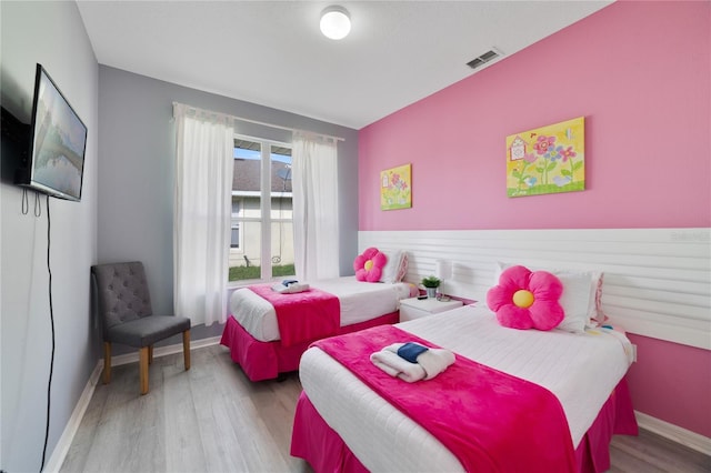 bedroom with light hardwood / wood-style floors