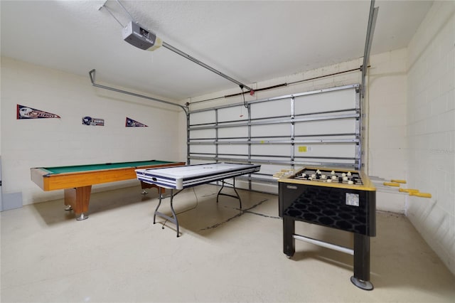 recreation room featuring concrete flooring