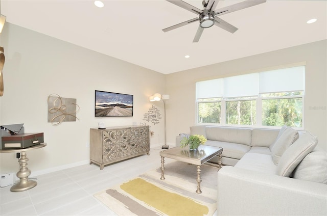 tiled living room featuring ceiling fan