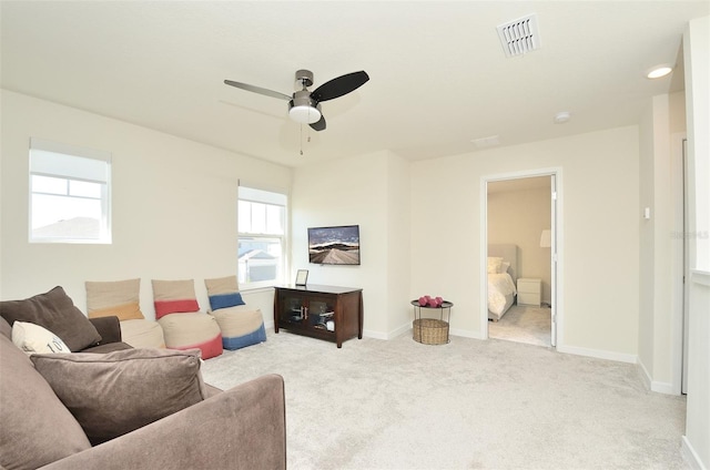 4963 Royal Point Ave, Kissimmee, FL 34746 - carpeted living room with a ceiling fan and baseboards