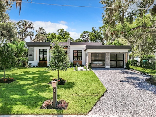 modern home featuring a front yard