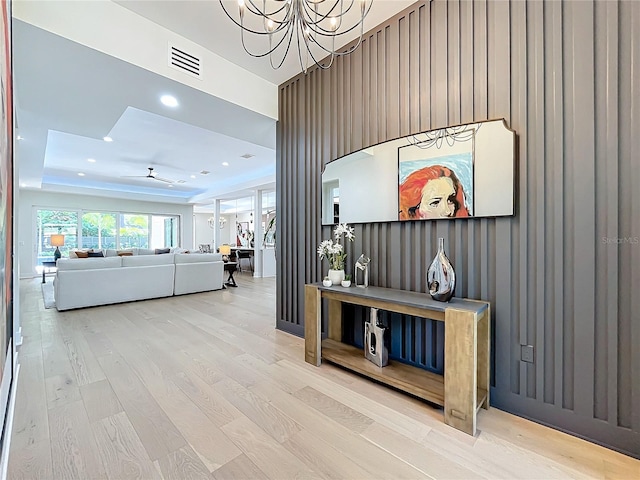 interior space featuring hardwood / wood-style floors and a notable chandelier