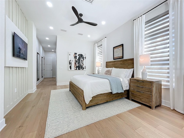 bedroom featuring light hardwood / wood-style floors and ceiling fan