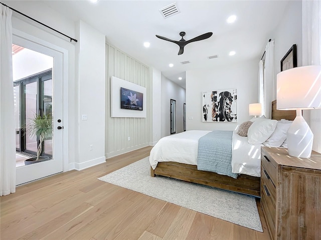 bedroom featuring ceiling fan, access to exterior, and light hardwood / wood-style flooring