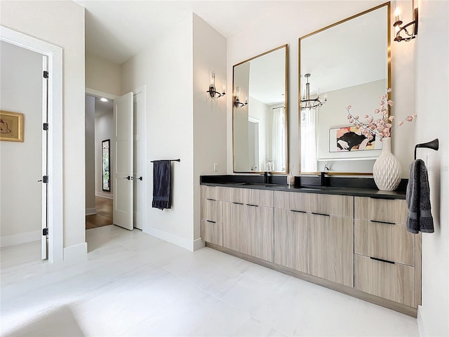 bathroom featuring tile patterned flooring and vanity