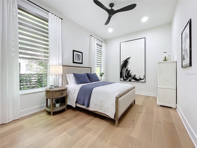 bedroom featuring light wood-type flooring and ceiling fan