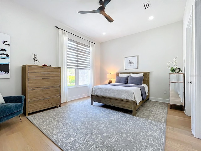 bedroom with ceiling fan and light hardwood / wood-style flooring